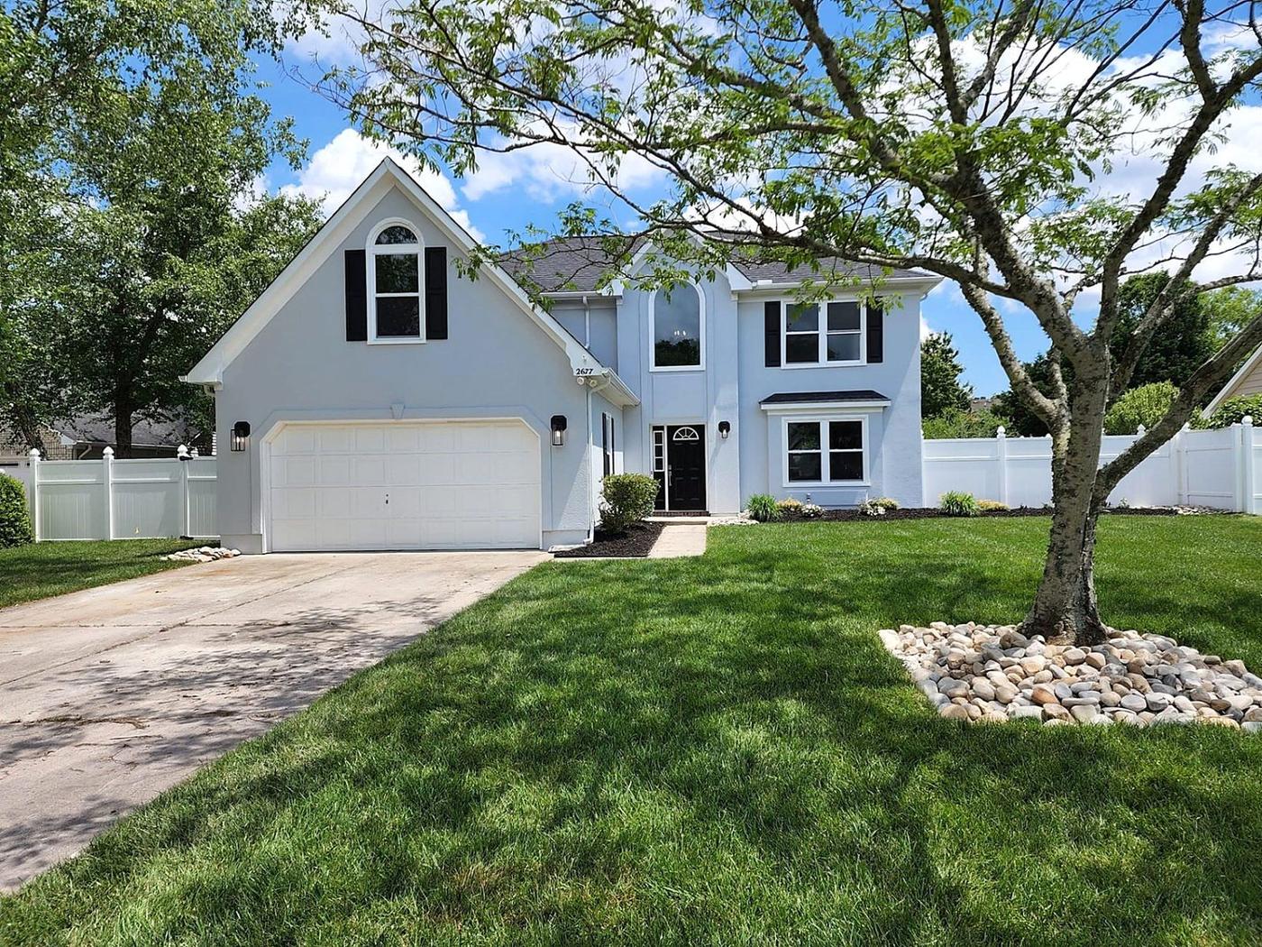 Freshly updated home exterior with modern paint, trim, and curb appeal landscaping in Hampton Roads VA